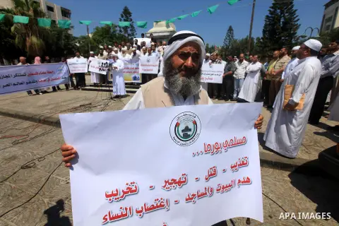 Palestinians member of the Ministry of Awqaf and Religious Affairs, during a demonstration calling to stop killing the Burmese Muslims in Myanmar, in Gaza City, July 22, 2012. Dozens of Muslims were killed and thousands...