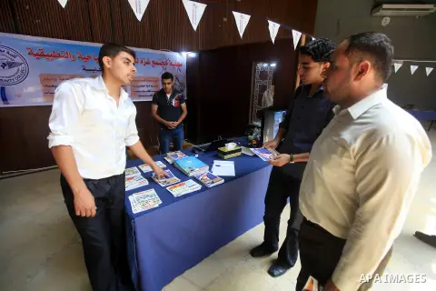 Palestinian students participate in the exhibition for Palestine colleges in the Rashad Shawa Center in Gaza City, on July 22, 2012.. Photo by Majdi Fathi