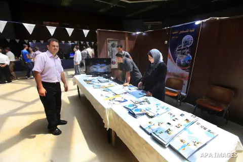 Palestinian students participate in the exhibition for Palestine colleges in the Rashad Shawa Center in Gaza City, on July 22, 2012.. Photo by Majdi Fathi