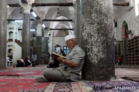 Palestinians read the holy Qur'an at the mosque in West Bank City of Nablus, on 23 July 2012. Muslims around the world refrain from eating, drinking and sexual intercourse from dawn till dusk during Ramadan, the holiest...