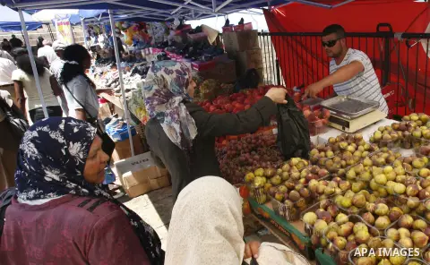 A Palestinian man sells fruits during Ramadan in Jerusalem's old city, on July 23, 2012. Muslims around the world abstain from eating, drinking and conducting sexual relations from dawn till dusk during Ramadan, the holi...