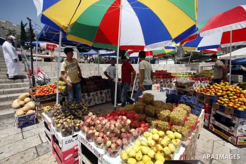 A Palestinian man sells fruits during Ramadan in Jerusalem's old city, on July 23, 2012. Muslims around the world abstain from eating, drinking and conducting sexual relations from dawn till dusk during Ramadan, the holi...