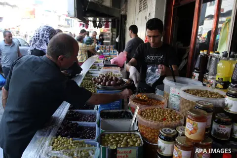 A Palestinian vendor sells pickles during the fasting month of Ramadan in the West Bank city of Ramallah, on July 23, 2012. Muslims around the world abstain from eating, drinking and conducting sexual relations from dawn...