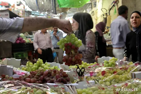 Palestinians shop at the traditional market in the West Bank city of Nablus, on the five day of the holy month of Ramadan ,on 24 July 2012. Muslims around the world abstain from eating, drinking and conducting sexual rel...