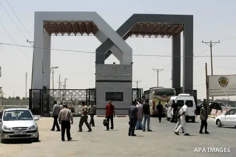 Palestinians wait the buses to cross to Egypt through the Rafah border crossing between the Gaza Strip and Egypt in Gaza city, on 24 July 2012. Egyptian Ambassador of Arab Republic , of the Palestinian Authority, Yasser...