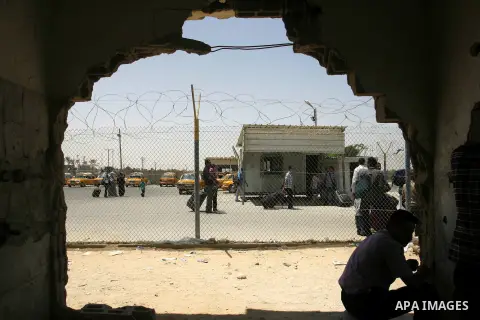 Palestinians wait the buses to cross to Egypt through the Rafah border crossing between the Gaza Strip and Egypt in Gaza city, on 24 July 2012. Egyptian Ambassador of Arab Republic , of the Palestinian Authority, Yasser...
