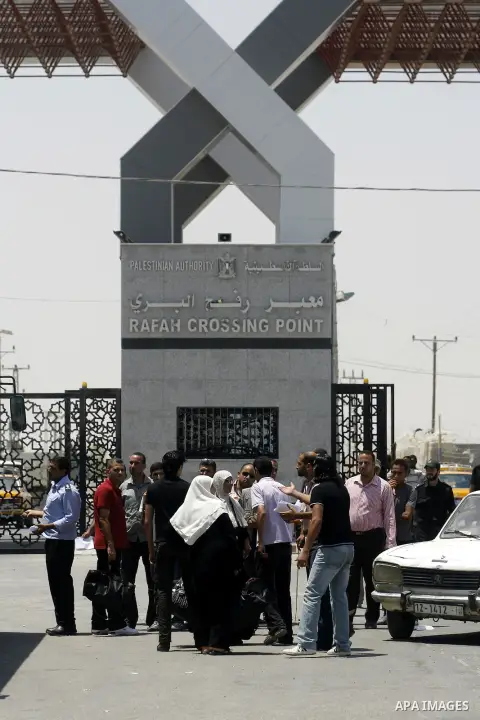 Palestinians wait the buses to cross to Egypt through the Rafah border crossing between the Gaza Strip and Egypt in Gaza city, on 24 July 2012. Egyptian Ambassador of Arab Republic , of the Palestinian Authority, Yasser...