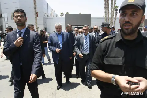 Palestinian Prime Minister in Gaza Strip, Ismail Haniya, leaves Rafah border crossing in the southern Gaza Strip on July 25, 2012. will meet with Egyptian President Mohamed Morsi at the presidential palace, in Cairo, Egy...