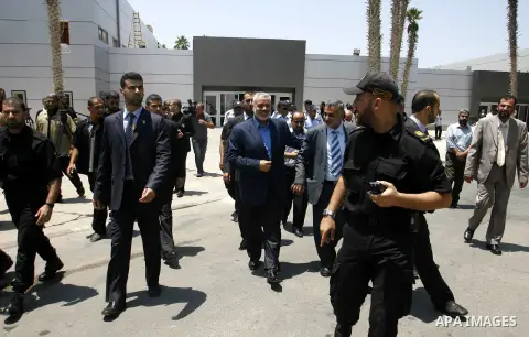 Palestinian Prime Minister in Gaza Strip, Ismail Haniya, leaves Rafah border crossing in the southern Gaza Strip on July 25, 2012. will meet with Egyptian President Mohamed Morsi at the presidential palace, in Cairo, Egy...