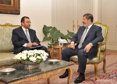 Egyptian President Mohamed Morsi (R) meeting with the newly nominated Prime Minister Hisham Qandil, at the presidential palace, in Cairo, Egypt, 25 July 2012. Egyptian President Mohammed Morsi named the country's new Pri...