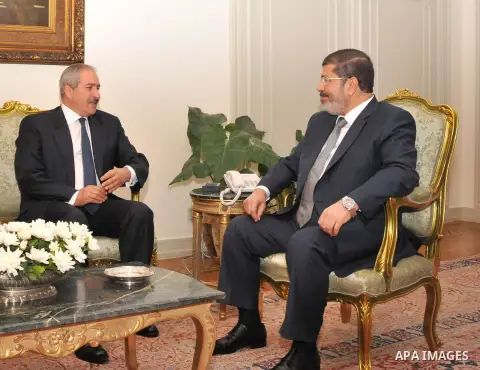 Egyptian President Mohamed Morsi (R) meeting with Jordanian Foreign Minister Nasser Judeh at the Egyptian Presidential Palace in Cairo, on July 25, 2012. Photo by Ahmed Fouad \ EGYPTIAN PRESIDENCY