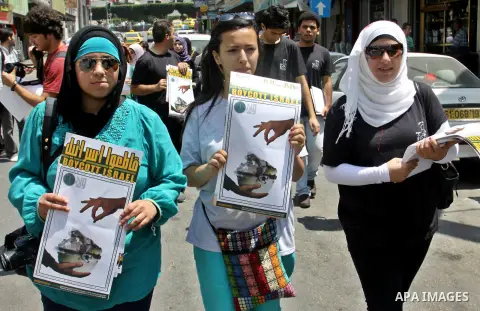 Palestinian youths demonstrate for a boycott of Israeli goods and support national products during a protest in the West Bank city of Nablus,on July 26,2012. Photo by Nedal Shtieh . Photo by Nedal Eshtayah