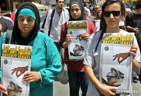 Palestinian youths demonstrate for a boycott of Israeli goods and support national products during a protest in the West Bank city of Nablus,on July 26,2012. Photo by Nedal Shtieh . Photo by Nedal Eshtayah