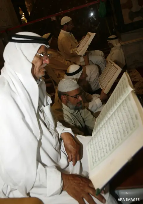 Palestinian reads the holy Qur'an at dome of the rock near al-Aqsa Mosque in Jerusalem's Old City during the holy month of Ramadan, on 26 July 2012. Muslims around the world abstain from eating, drinking and conducting s...
