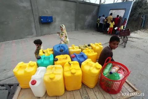 Palestinians fill their bottles a potable water at a water purification station, in Deir al-Balah central Gaza Strip, on July 26. 2012. Palestinians suffer from the severe lack of potable water during the holy fasting mo...