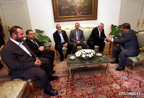 Egyptian President Mohamed Morsi (R) meets with Palestinian Prime Minister in Gaza Ismail Haniyeh and members of Hamas leaders at the presidential palace, in Cairo, Egypt, 26 July 2012. Haniyeh is visiting Egypt for talk...