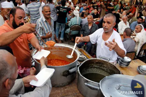 Egyptian people getting ready for break their fast at the dinner table, in Cairo on 26 July 2012. Egyptians prepare to have an break their fast meal during fasting holy month of Ramadan, which is the Muslim month of fast...