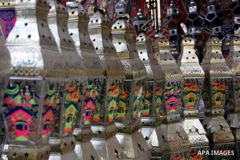Egyptians hangs Ramadan lanterns (or Fanoos Ramadan) that are displayed for sale at a shop during the Muslim fasting month of Ramadan, in Cairo July 26, 2012. Photo by Amr Mostafa