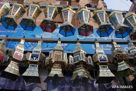 Egyptians hangs Ramadan lanterns (or Fanoos Ramadan) that are displayed for sale at a shop during the Muslim fasting month of Ramadan, in Cairo July 26, 2012. Photo by Amr Mostafa