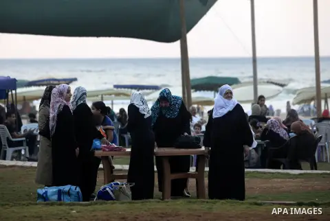 Palestinians getting ready for break their fast at Gaza beach during the fasting holy month of Ramadan, in Gaza city on 26 July 2012. Muslims throughout the world are celebrating the fasting month of Ramadan, the holiest...