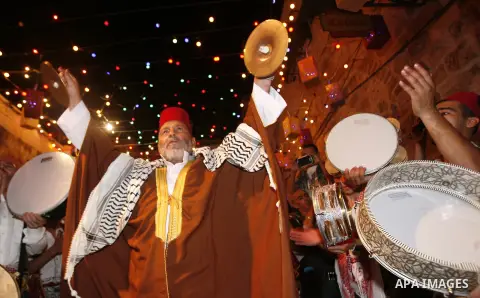 Palestinian musicians perform in Jerusalem's Old City during celebrations to mark the breaking of the fast on the seventh day of the holy month of Ramadan, on July 26, 2012. Photo by Mahfouz Abu Turk