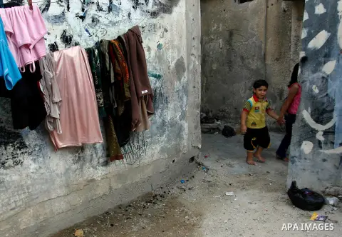 Palestinian children play in front their home during Ramadan in Rafah refugee camp southern Gaza strip, on July 27, 2012. Photo by Eyad Al Baba