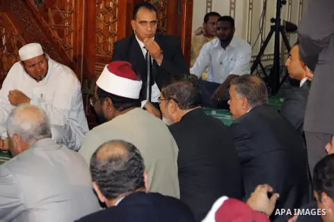 Egyptian President Mohamed Morsi performing Friday noon prayers at a mosque in the district of Fayoum, south west of Cairo, during the Muslim holy fasting month of Ramadan, on July 27, 2012. Photo by Amr Mostafa