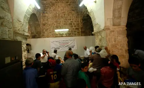 Palestinian volunteers deliver food for indigent Muslims during the fasting month of Ramadan in Jerusalem on July 28, 2012. During Ramadan eating, drinking, sex and smoking is banned and restaurants are forbidden to serv...