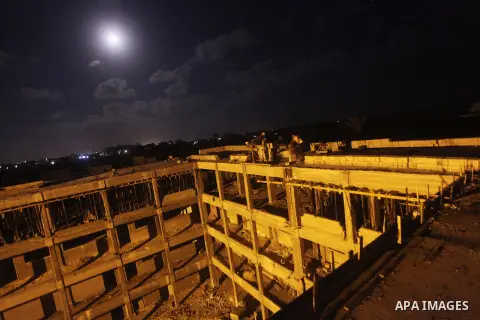Palestinian construction workers work at night in Deir al-Balah in central Gaza Strip on 29 July 2012. Palestinian construction workers work during the night in the month of Ramadan because of the high temperatures they...