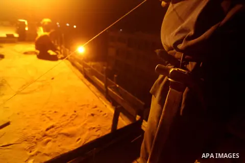 Palestinian construction workers work at night in Deir al-Balah in central Gaza Strip on 29 July 2012. Palestinian construction workers work during the night in the month of Ramadan because of the high temperatures they...