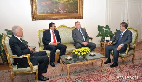 Egyptian President Mohamed Morsi (R) meets with Libyan Foreign Affairs Minister Ashur bin Khayal (C) and Tunisian Foreign Minister Rafik Abdessalem (L), at the presidential palace, in Cairo, Egypt, 29 July 2012. Photo by...