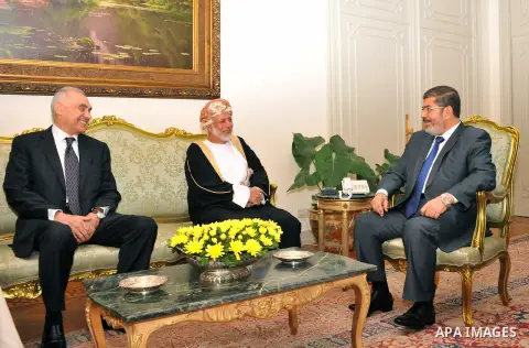 Egyptian President Mohamed Morsi (R) meets with Foreign Minister of Oman Yusuf bin Alawi (2-R)) with the presence of Egyptian Foreign Minister Mohammed Kamel Amr (L) at the presidential palace, in Cairo, Egypt, 29 July 2...
