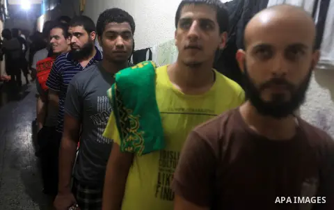Palestinian inmates inside their cell during the holy month of Ramadan at prison controlled by the Hamas police in Gaza city on 29 July 2012. Hamas police released more than 150 criminal inmates before the fasting month...