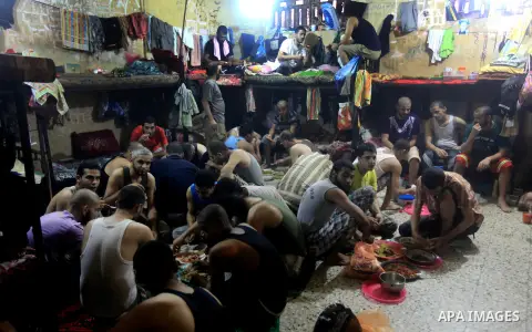Palestinian inmates break their fast during the holy month of Ramadan at prison controlled by the Hamas police in Gaza city on 29 July 2012. Hamas police released more than 150 criminal inmates before the fasting month o...