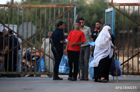 Relatives of Palestinian inmates enter the prison controlled by the Hamas police in Gaza city on 29 July 2012 to participate inmates breaking their fast with during the holy month of Ramadan. Hamas police released more t...