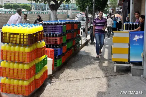 A Palestinian vendor sells bottles of juice in his shop in West Bank city of Nablus on July 30, 2012. Muslims throughout the world are celebrating the fasting month of Ramadan, the holiest month in the Islamic calendar,...