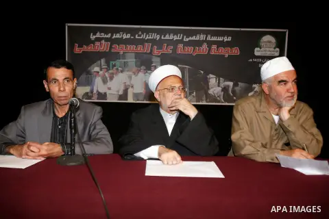 Sheikh Raed Salah (R), Sheikh Ikrima Sabri (C) and lawyer Khaled Zabarqa during a press conference to reveal the last of Israeli assaults on al-Aqsa Mosque and the hill of Bab al-maghareba, in Jerusalem city on 31 July 2...