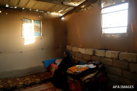 A Palestinian indigent woman at her home during holy month of Ramadan, in Rafah refugee camp southern Gaza strip, 31 July 2012 . Photo by Eyad Al Baba