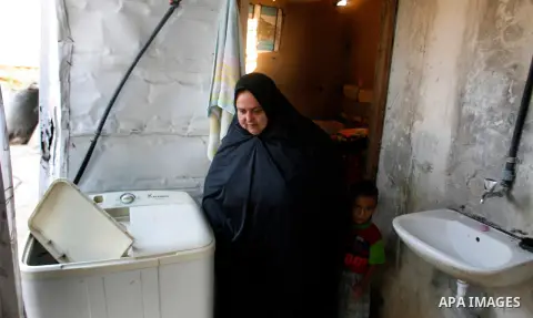 A Palestinian indigent woman at her home during holy month of Ramadan, in Rafah refugee camp southern Gaza strip, 31 July 2012 . Photo by Eyad Al Baba