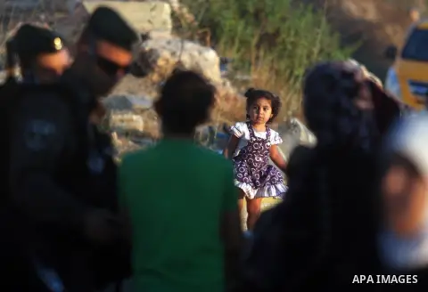 Palestinians wait to cross to Jerusalem from the Qalandia checkpoint near the West Bank city of Ramallah on Aug. 3, 2012. Palestinian Muslims are heading to Jerusalem to attend the third Friday prayers of the fasting mon...