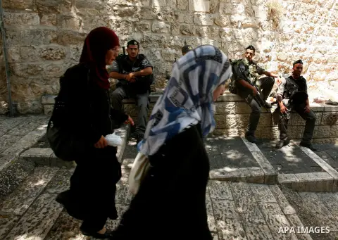 Palestinian Muslims walk outside the Dome of the Rock at the Al-Aqsa mosque compound in Jerusalem during the third Friday prayers of Islam's holy month of Ramadan on August 3, 2012. Muslims fasting in the month of Ramada...