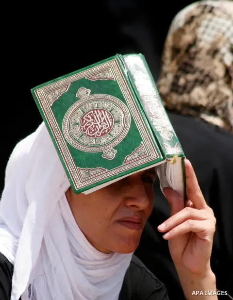 Palestinian worshipers pray outside the Dome of the Rock at the al-Aqsa mosque compound in Jerusalem during the third Friday prayers of the Muslim holy month of Ramadan on 03 August 2012. Muslims fasting in the month of...