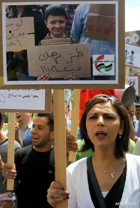 Palestinian demonstrators participate protest against rising prices and taxes in the West Bank, city of Nablus Aug. 04, 2012. Photo by Nedal Eshtayah