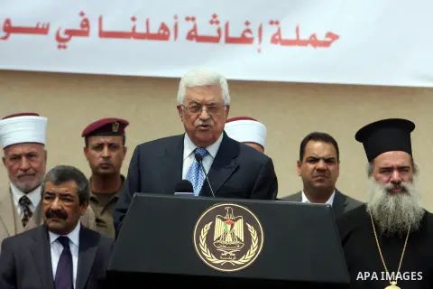 Palestinian President Mahmoud Abbas speaks to the media during a press event in the West Bank city of Ramallah August 5, 2012. An aid convoy left Ramallah on Sunday carrying food and medicine in a symbol of support for P...