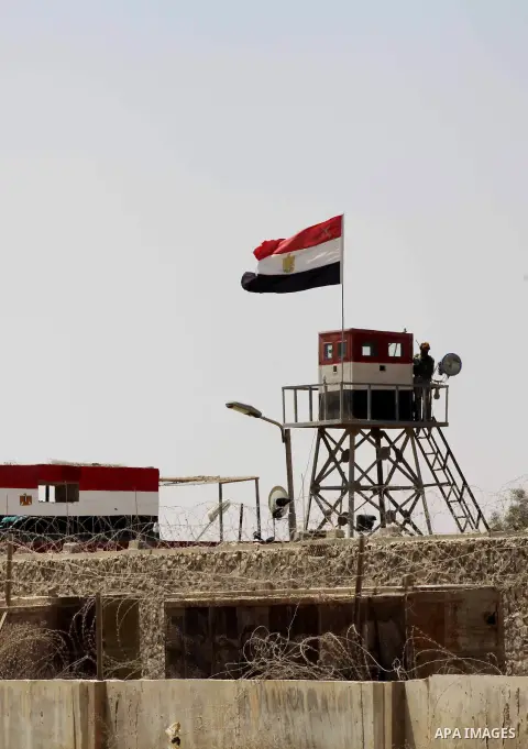 Egyptian soldiers stand guard on the border between Egypt and the southern Gaza Strip, near Rafah August 6, 2012. Egypt branded Islamist gunmen who killed 16 police near the Israeli border as "infidel" and promised on Mo...