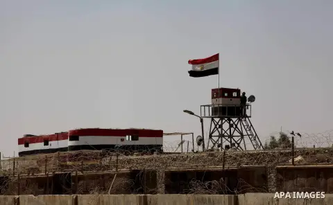 Egyptian soldiers stand guard on the border between Egypt and the southern Gaza Strip, near Rafah August 6, 2012. Egypt branded Islamist gunmen who killed 16 police near the Israeli border as "infidel" and promised on Mo...