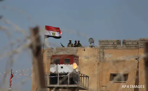 Egyptian soldiers stand guard on the border between Egypt and the southern Gaza Strip, near Rafah August 6, 2012. Egypt branded Islamist gunmen who killed 16 police near the Israeli border as "infidel" and promised on Mo...
