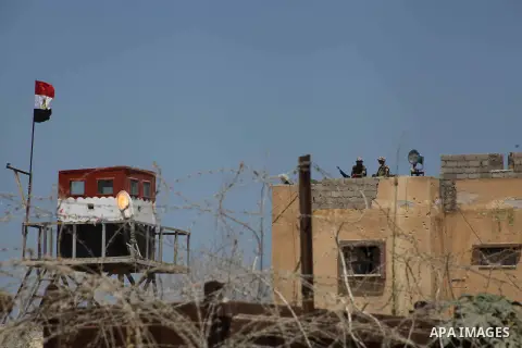 Egyptian soldiers stand guard on the border between Egypt and the southern Gaza Strip, near Rafah August 6, 2012. Egypt branded Islamist gunmen who killed 16 police near the Israeli border as "infidel" and promised on Mo...