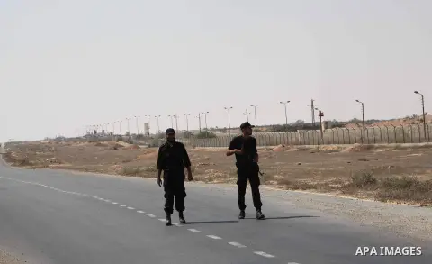 A Palestinian Hamas security guard on duty on the border between Egypt and Gaza strip in Rafah town southern Gaza strip on, 06 August 2012. Reports state that at least five gunmen were killed after they tried to infiltra...