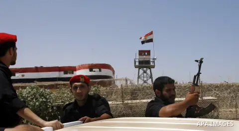 Palestinian security forces stand guard on the border between Egypt and the southern Gaza Strip, near Rafah August 6, 2012. Egypt has closed the terminal, the only gateway for Gaza's people after the deadly attack on its...